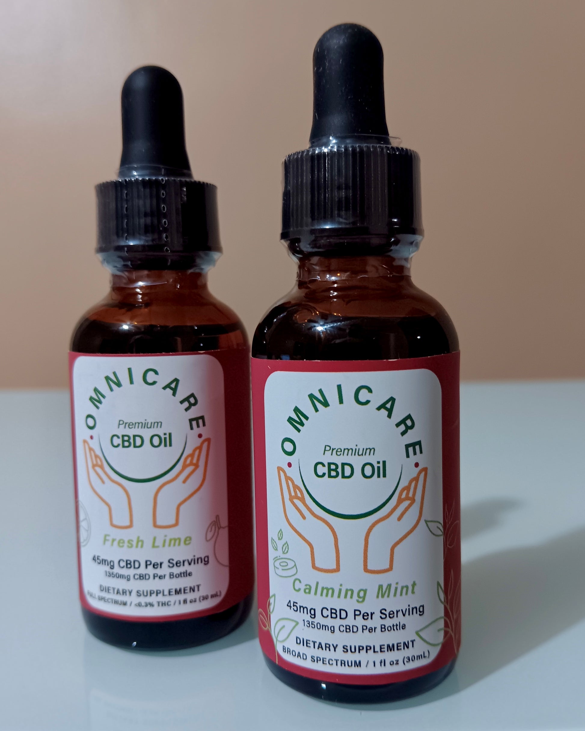 Day & Night CBD and THC Tincture Bundle – Broad Spectrum Calming Mint  and Full Spectrum Fresh Lime for daily calm and nighttime relaxation on a white surface with a tan background.